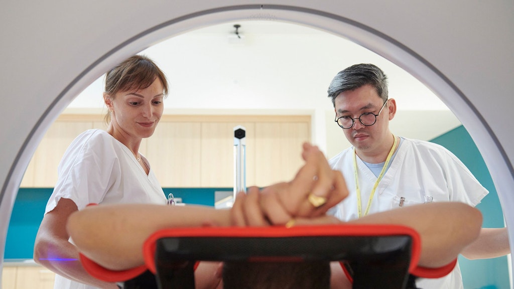 The picture shows a radiology team in action.
